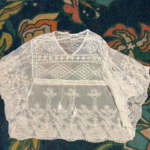 Amaryllis sheer top. One size fits most. Adjustable tie. I used as a cover up.